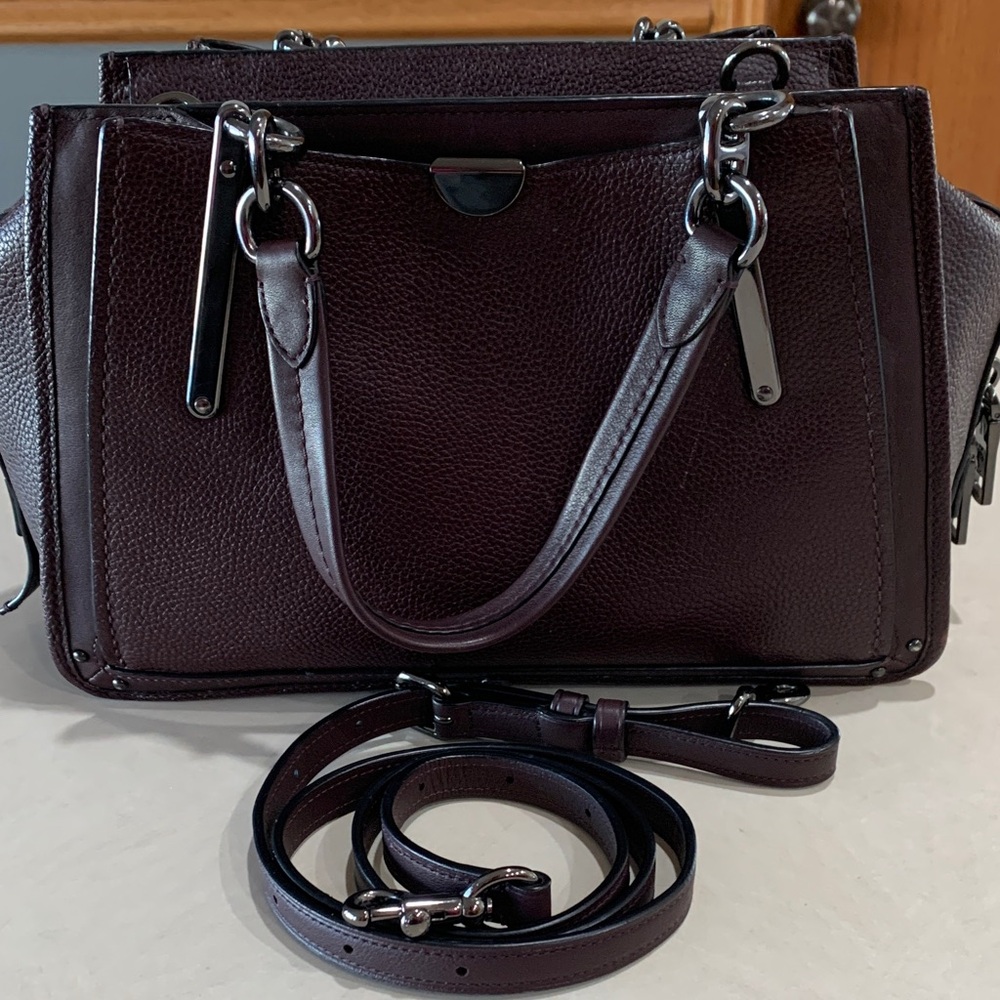 Coach Leather Handbag with shoulder straps. Plum in color